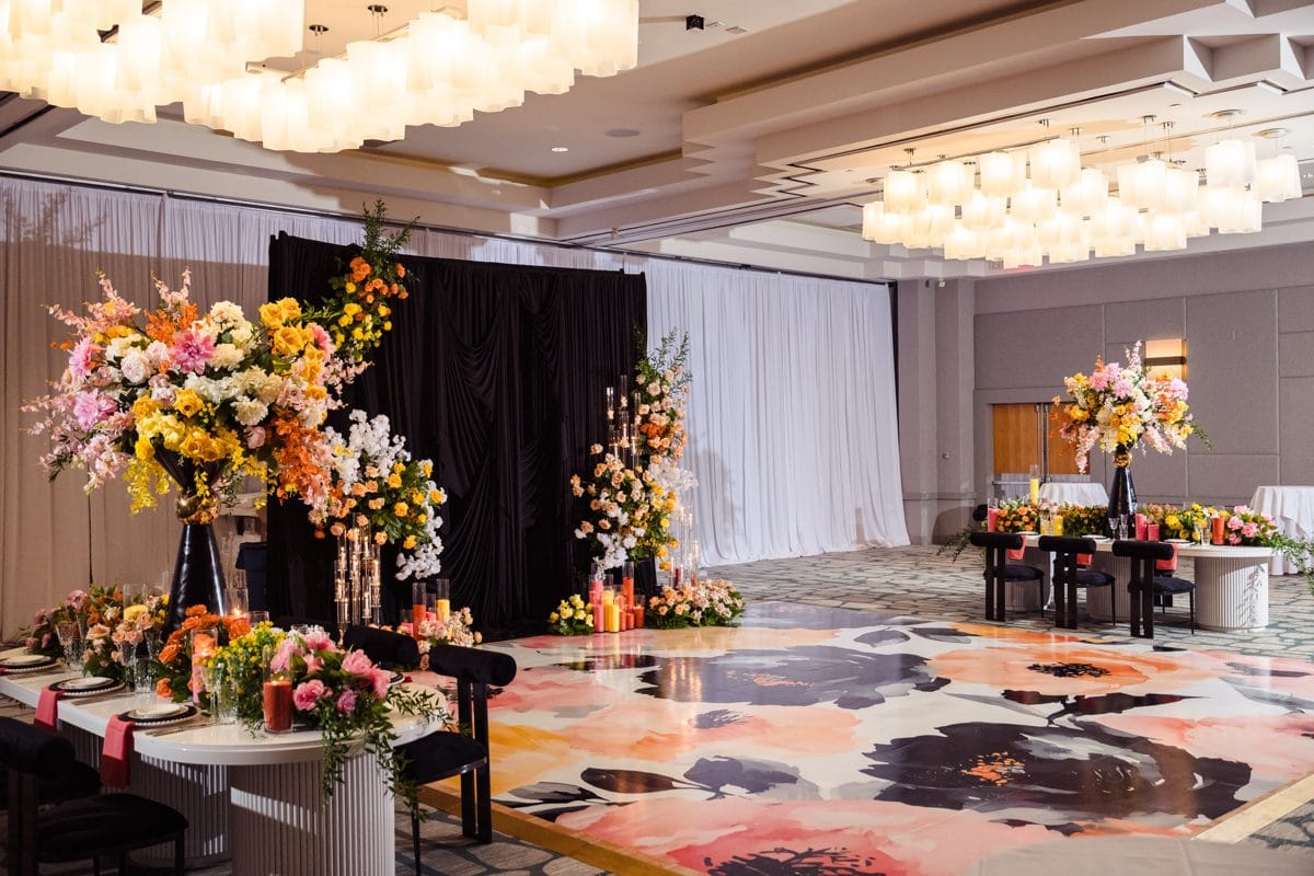 A luxury corporate event environment with large-scale floral design produced by Greystone Design Co.